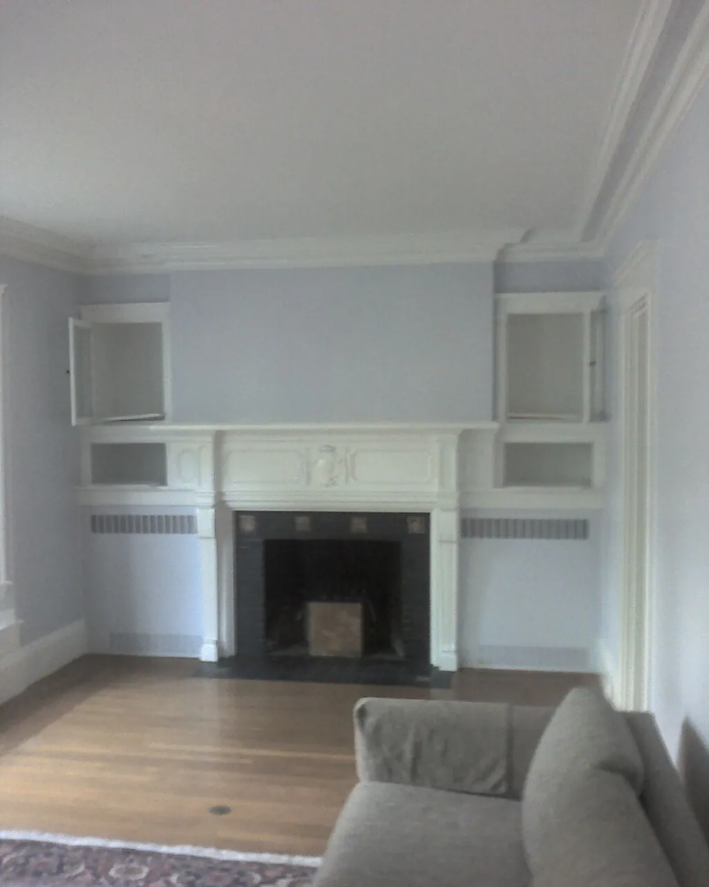 Living room with a painted fireplace surround