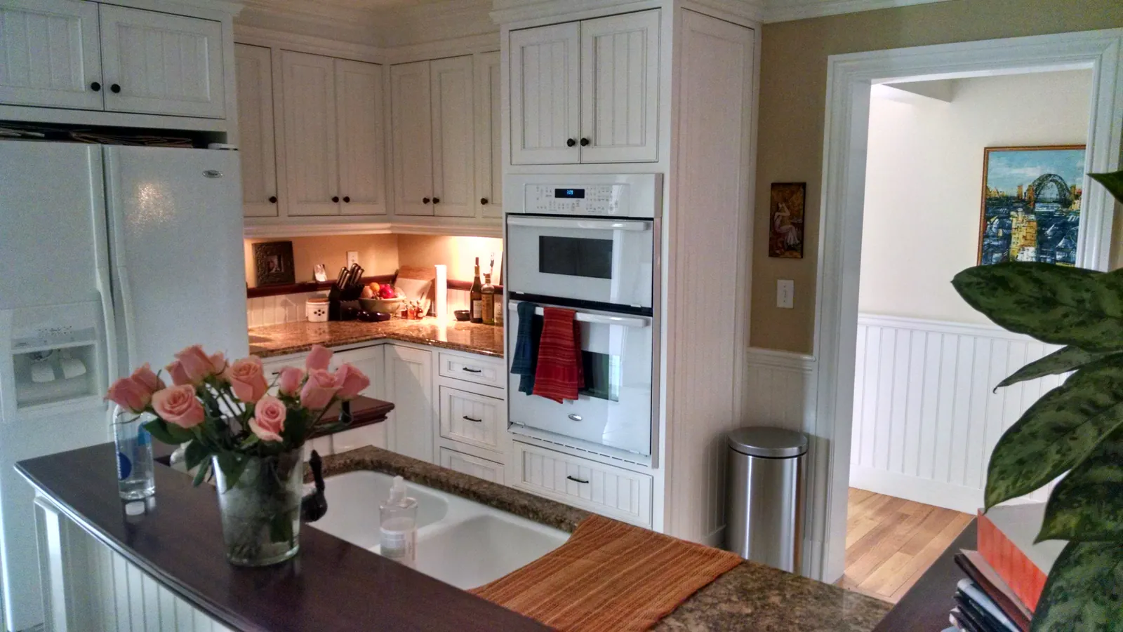 Kitchen with white painted cabinets and trim