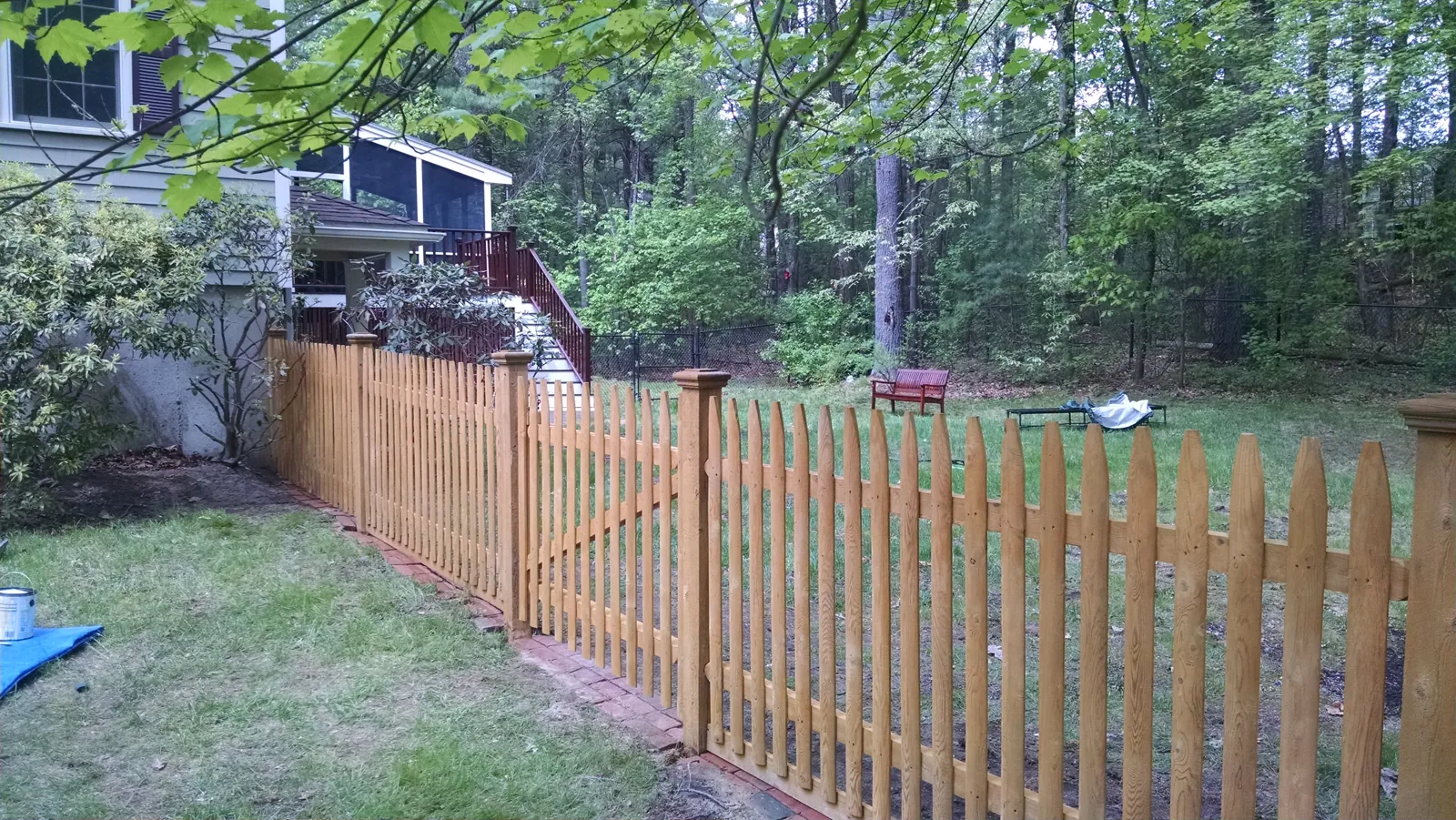 Freshly stained picket fence