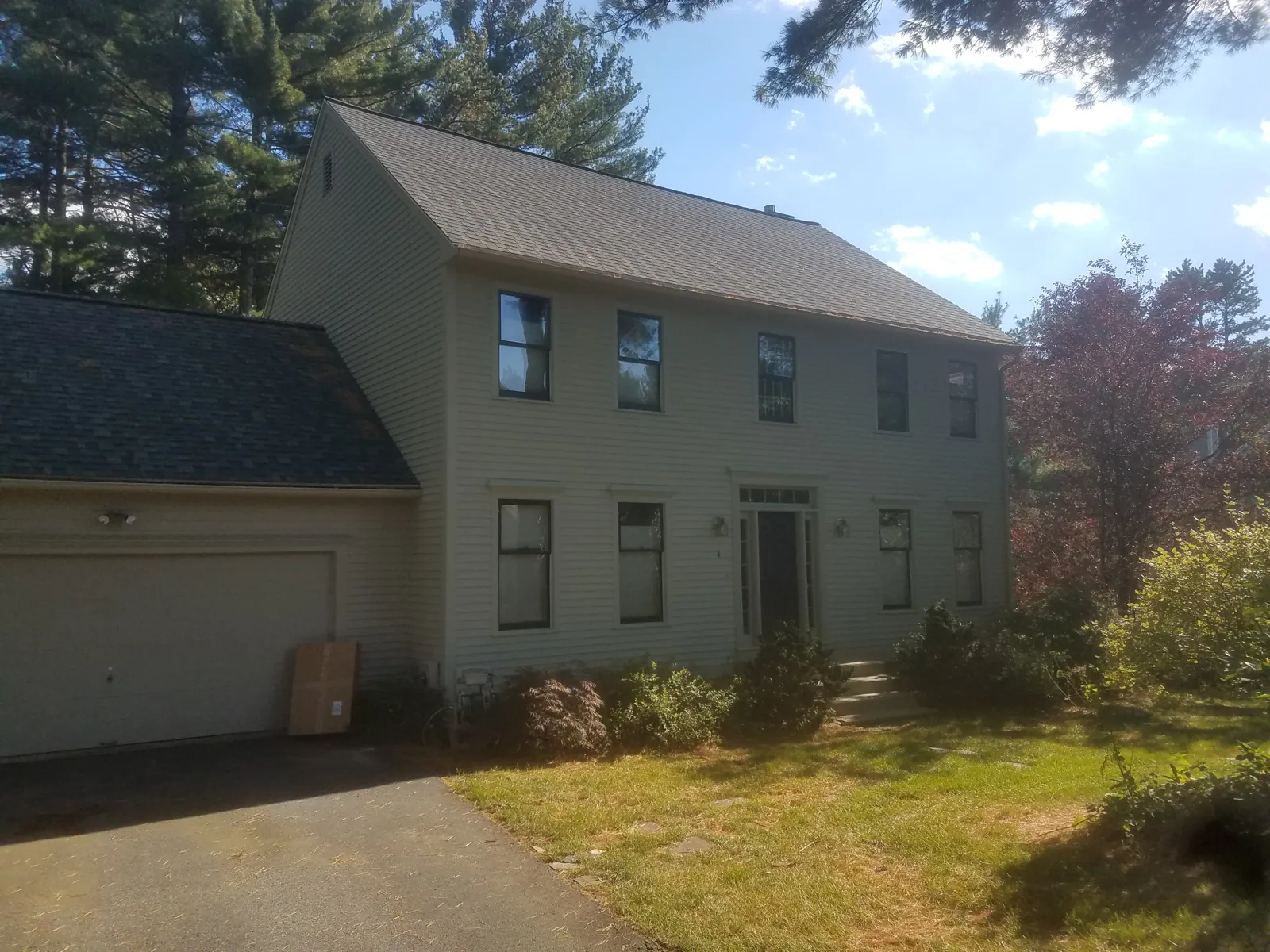Sage colonial with a side garage