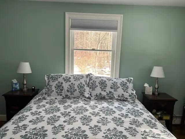 Bedroom painted a soft sage