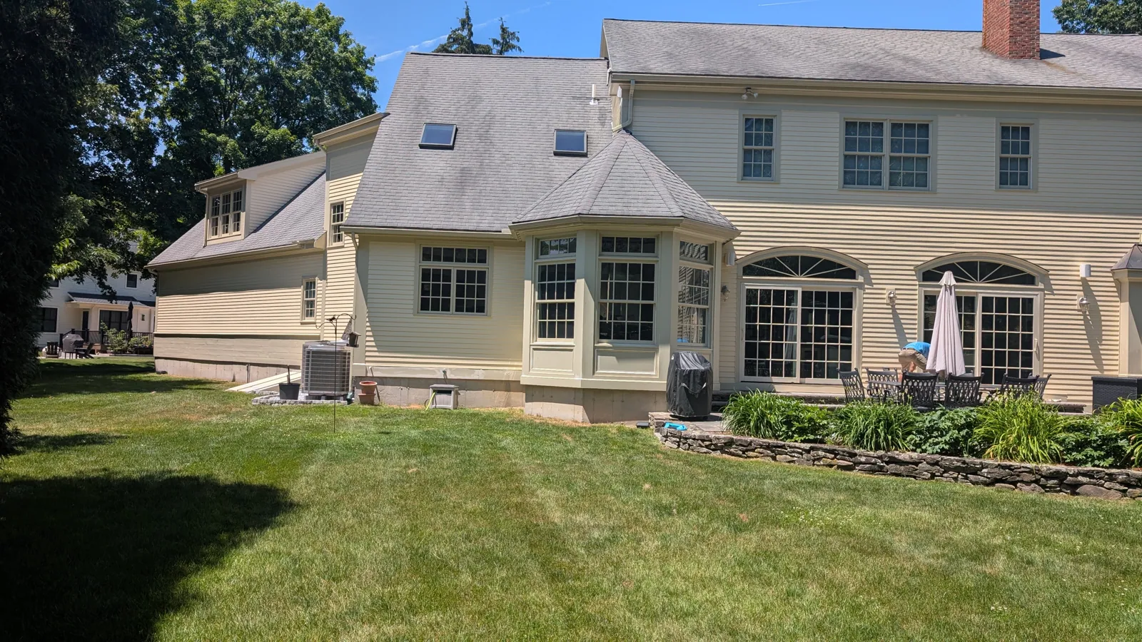 Cream colonial with arched windows, garden side