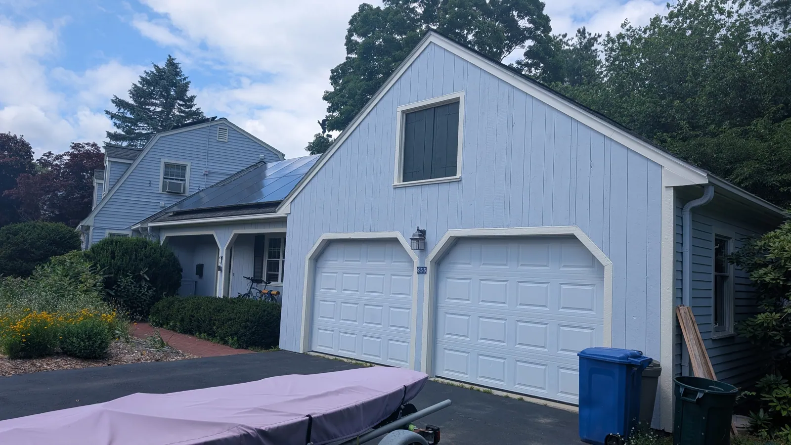 Pale gray garage with twin doors
