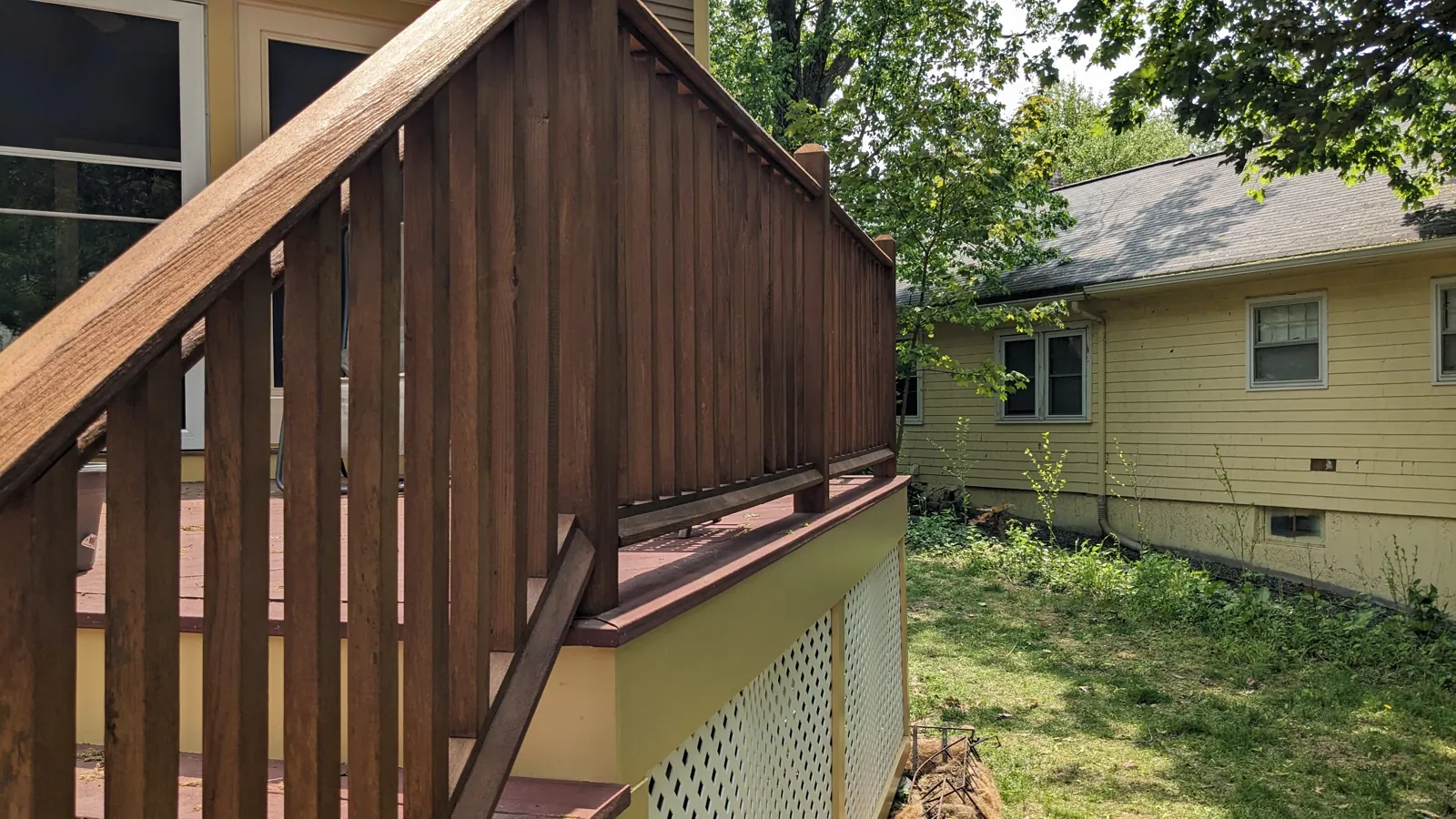 Stained deck stairs and railing