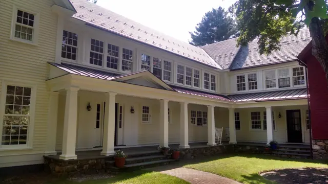 Cream colonial with a long columned porch