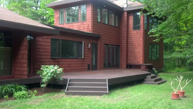 Red cedar home with a new deck and steps
