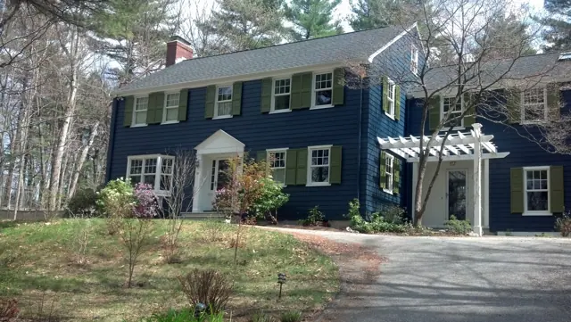 Navy colonial with green shutters