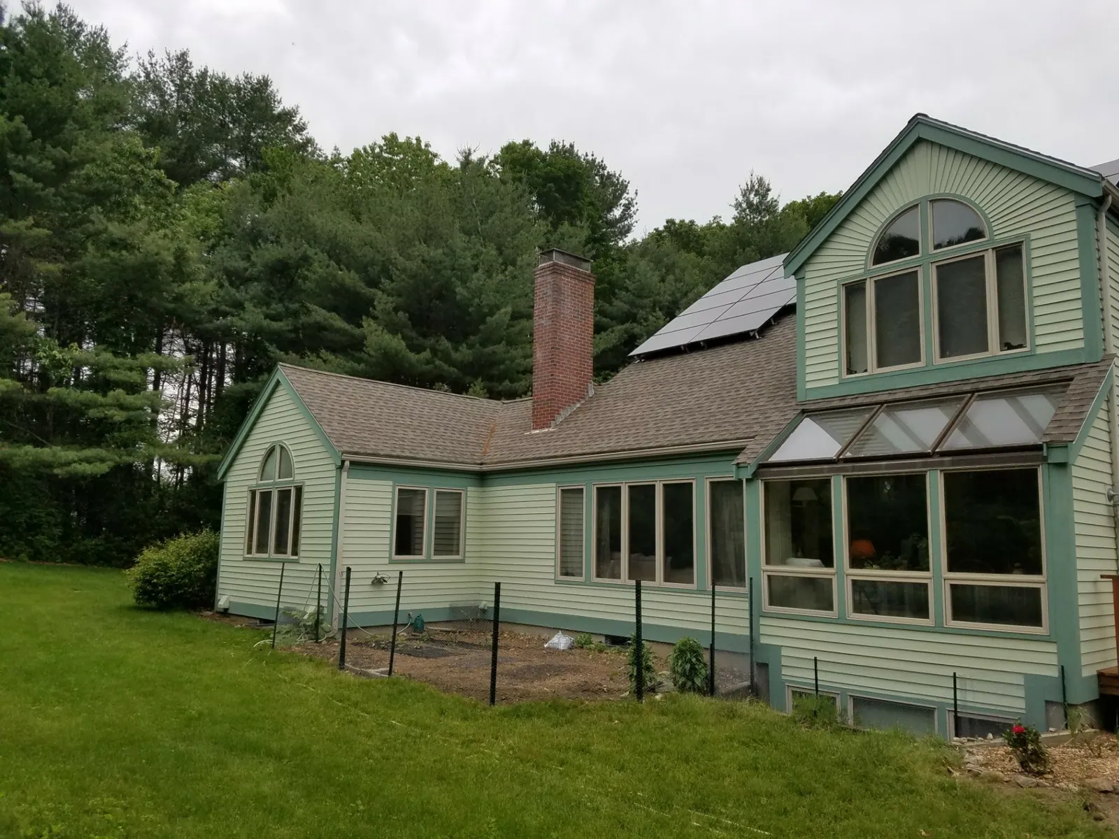 Sage cape with a sunroom painted by Beacon